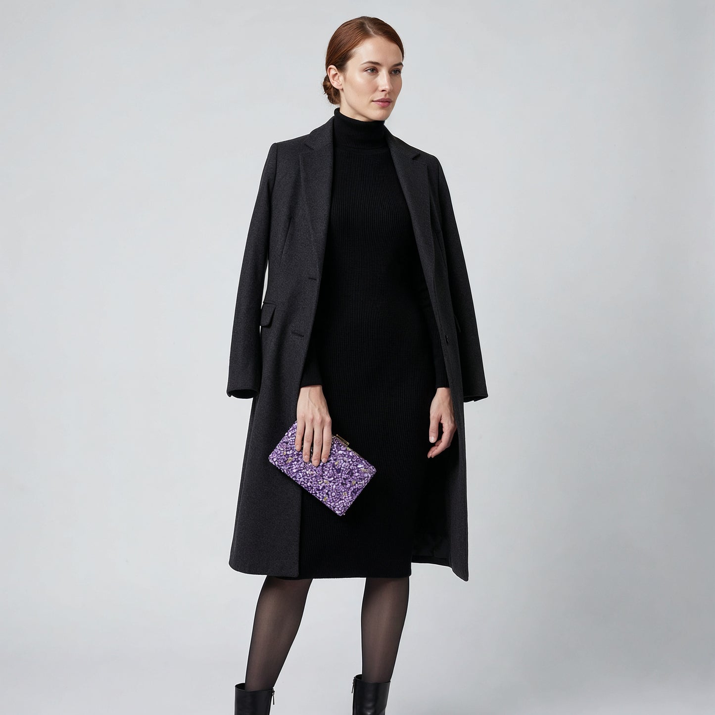 Model holding the Violet Gemma Natural Stone Box Clutch at her side, studio shot