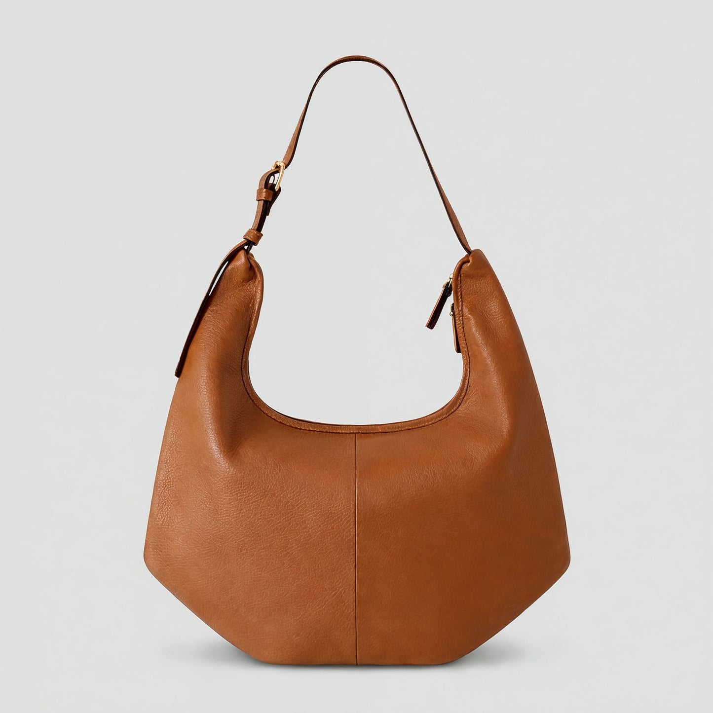 Ludovica leather hobo shoulder bag in tan on a light grey studio background