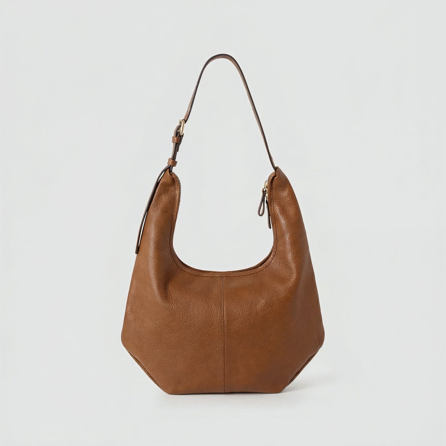 Ludovica leather hobo shoulder bag in tan on a light grey studio background