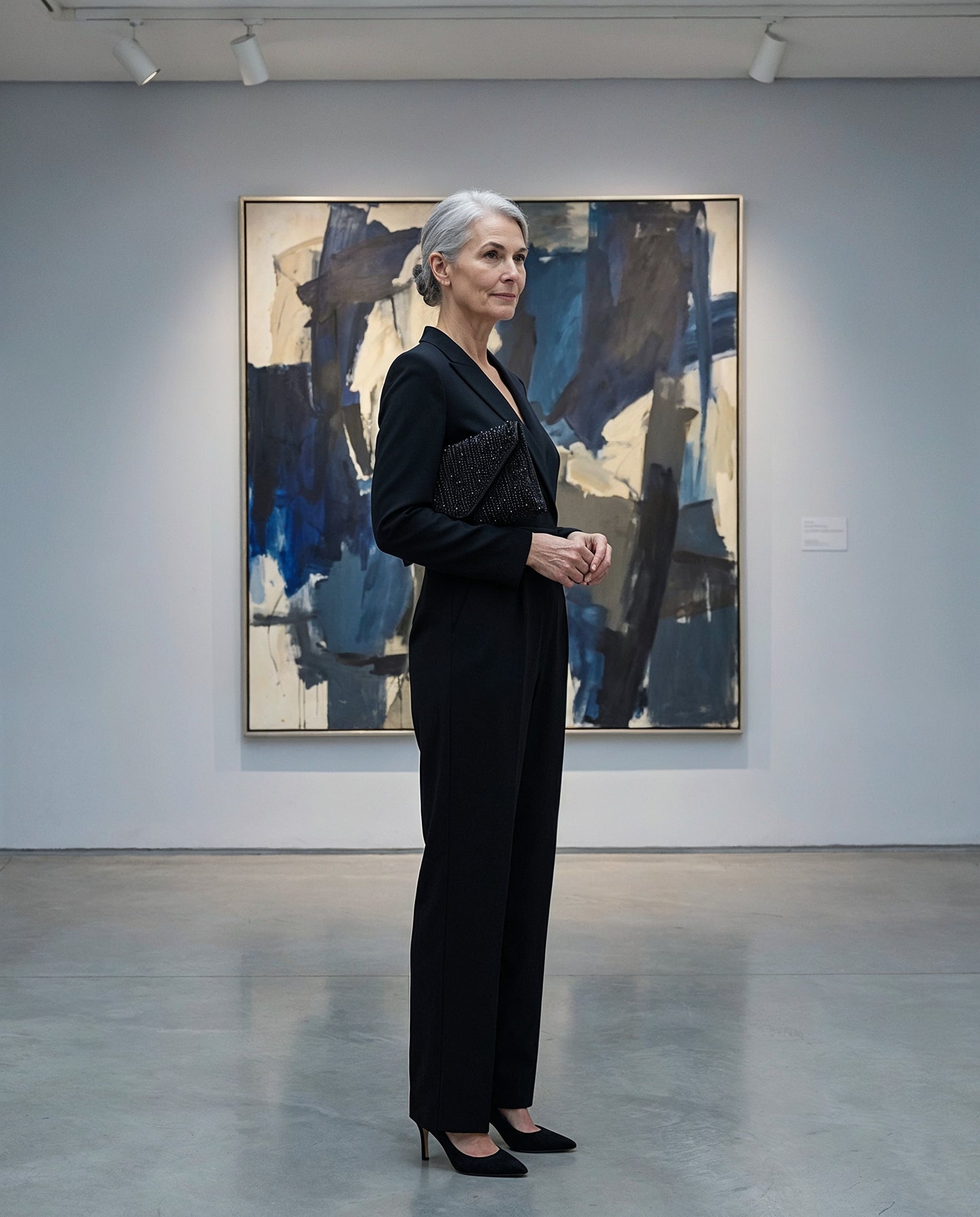 Woman with the Black Perlette Pearl & Crystal Envelope Clutch in an art gallery