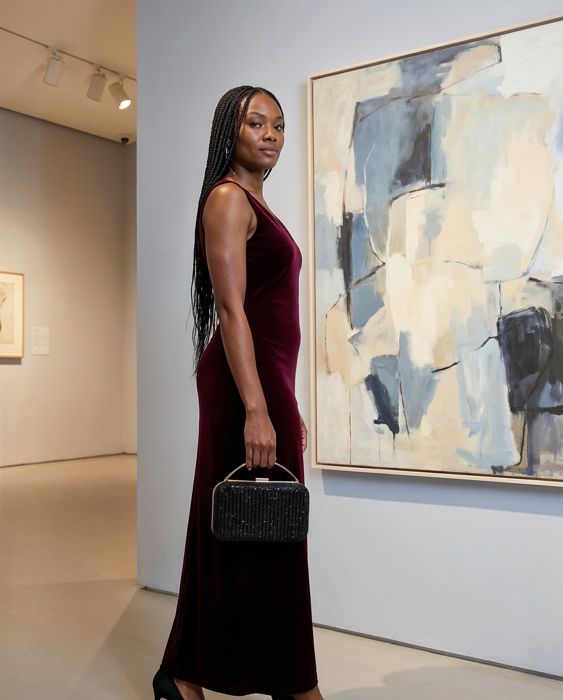 Woman with the Black Odette Crystal Minaudière Clutch in an art gallery