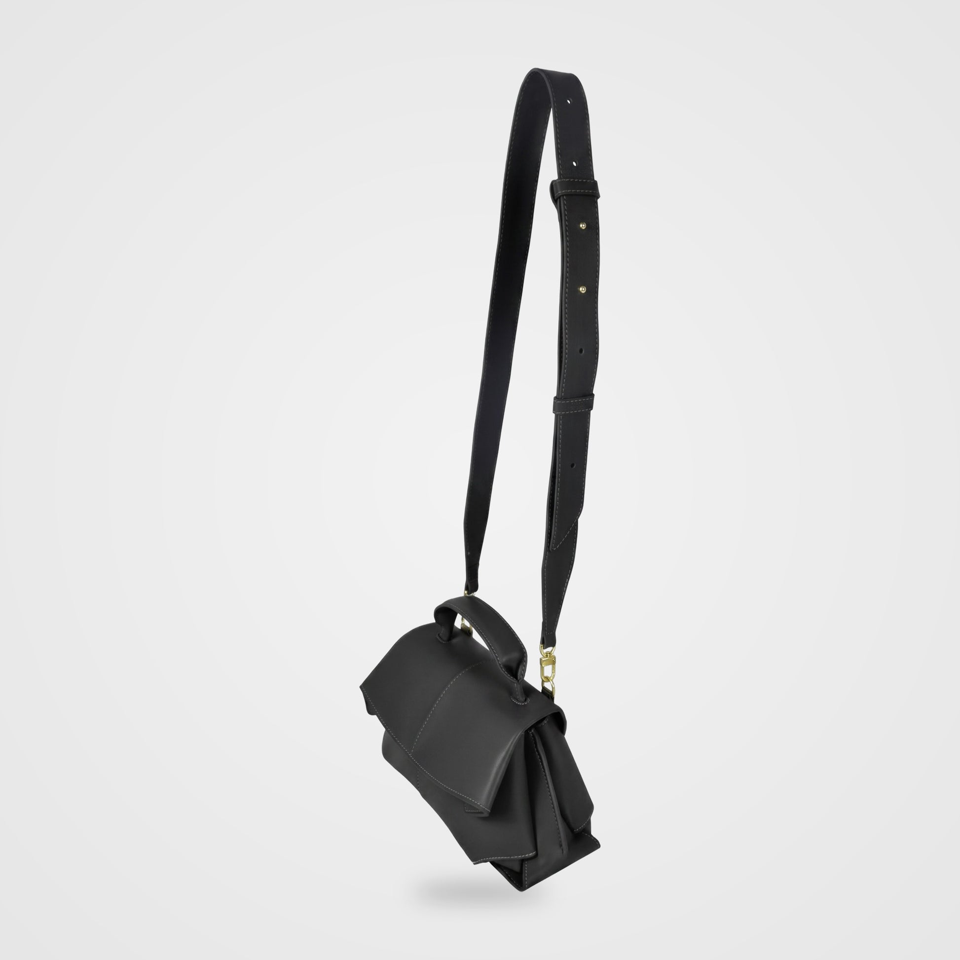Fiorella bag in Black hanging from its long adjustable shoulder strap