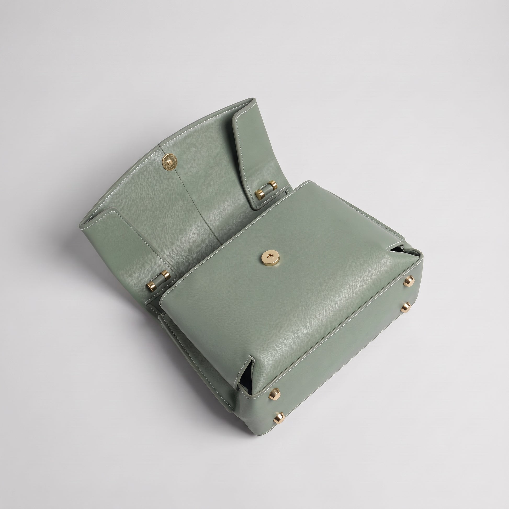 Fiorella bag in Sage Green open at a high angle showing tonal interior