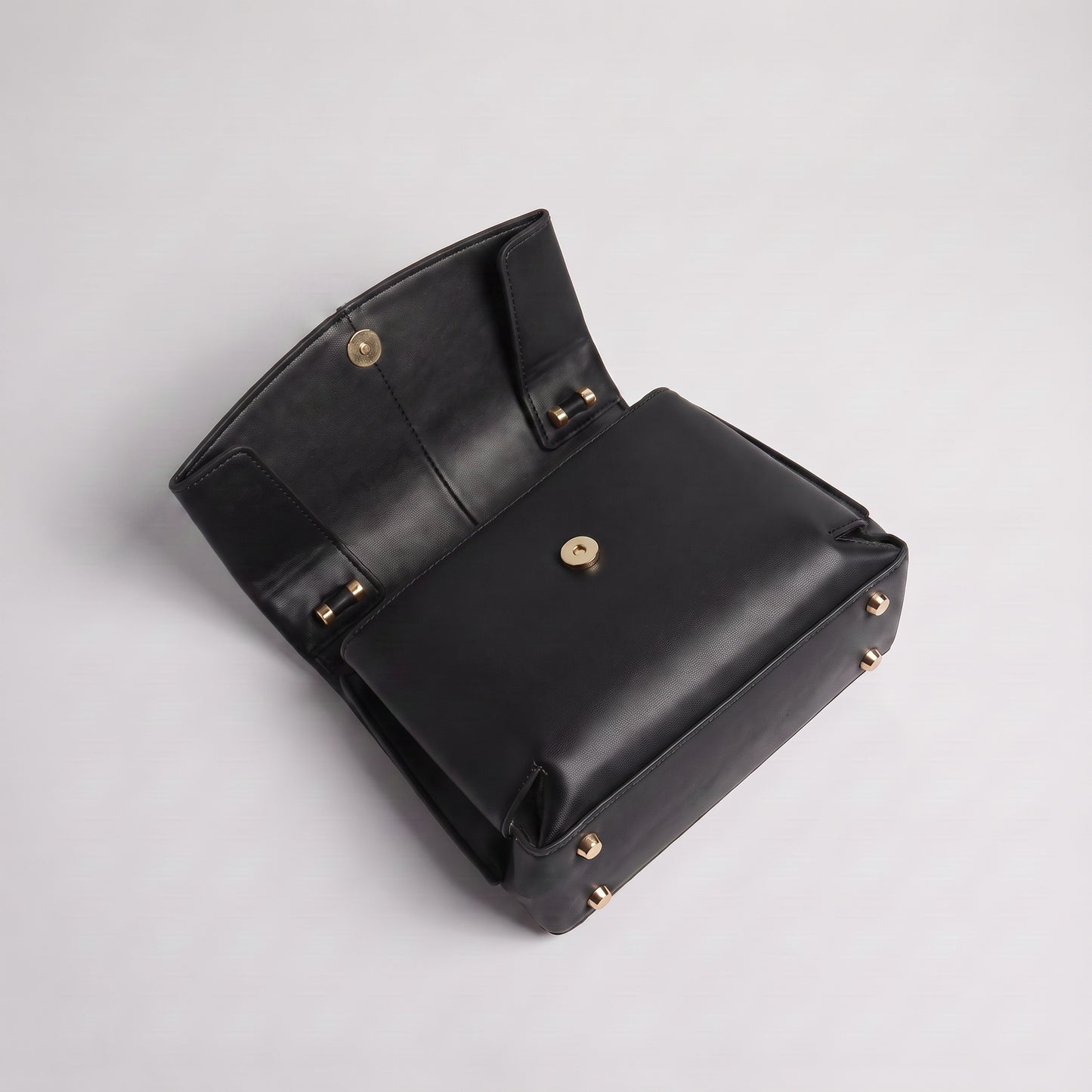 Fiorella bag in Black open at a high angle showing tonal interior