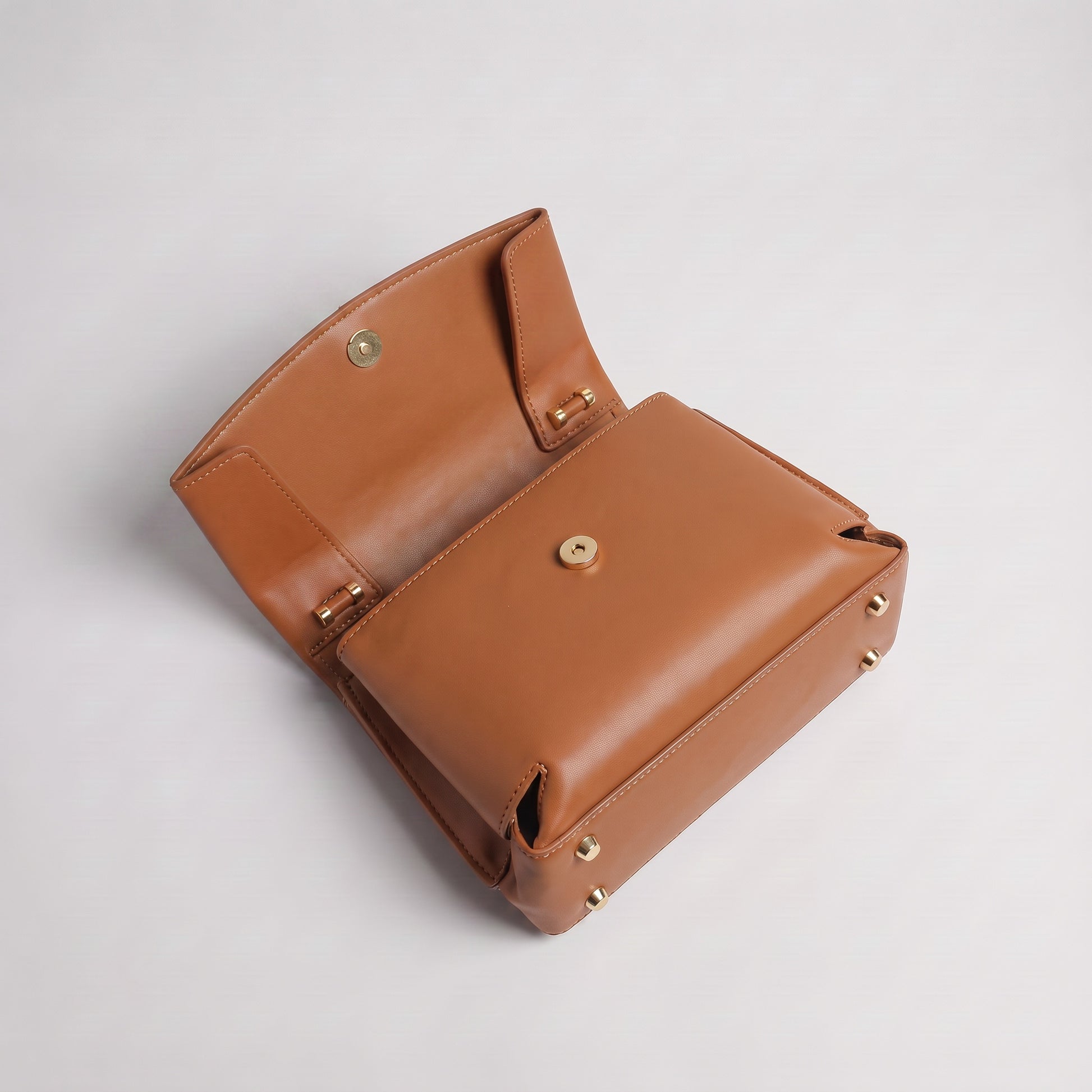 Fiorella bag in Cognac open at a high angle showing tonal interior