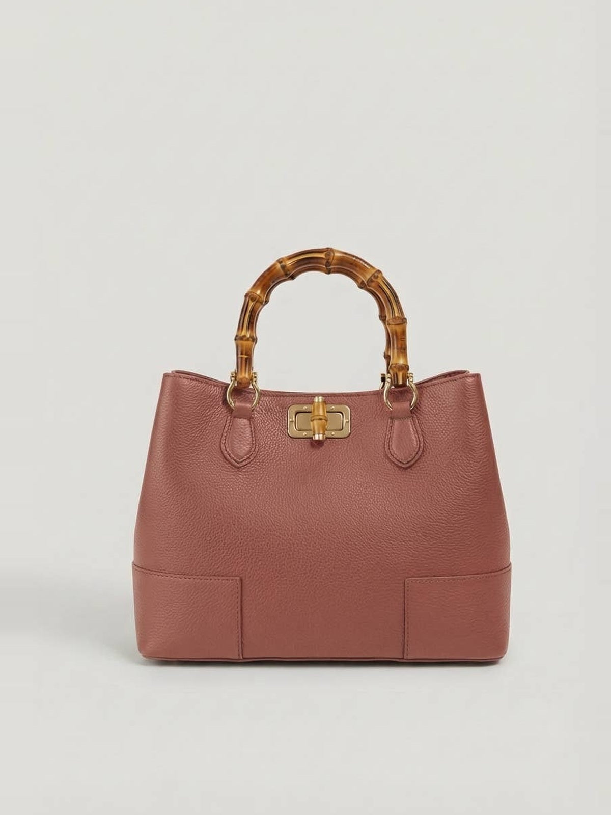 Ginevra Bamboo-Handle Leather Bag by Clemés in Dusty Rose, three-quarter studio shot on grey background