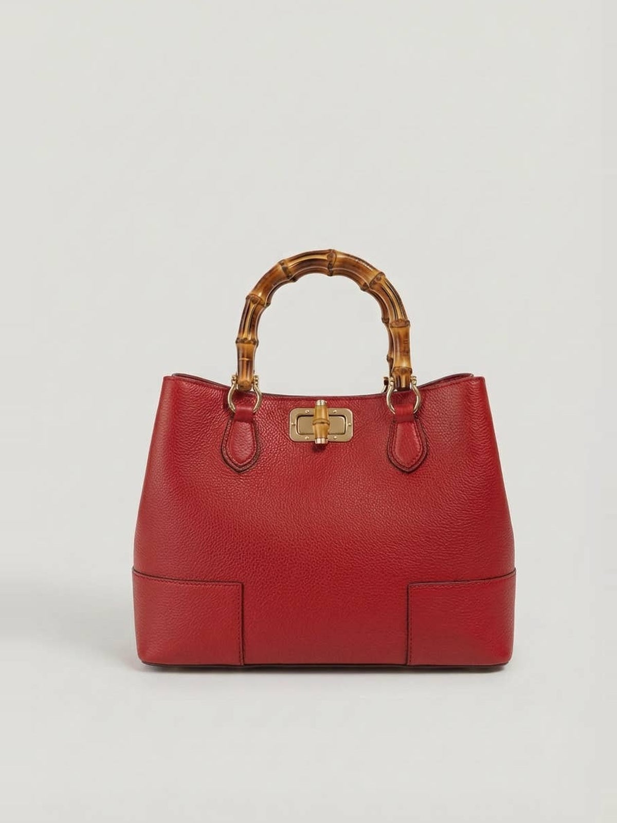 Ginevra Bamboo-Handle Leather Bag by Clemés in Red, three-quarter studio shot on grey background