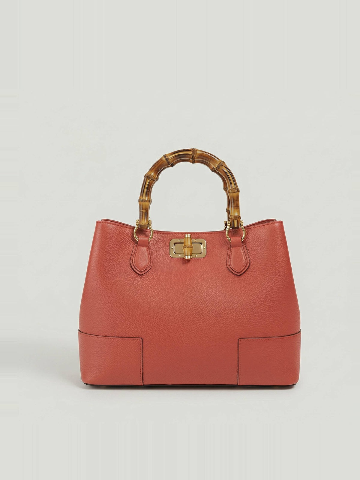 Ginevra Bamboo-Handle Leather Bag by Clemés in Terracotta, three-quarter studio shot on grey background