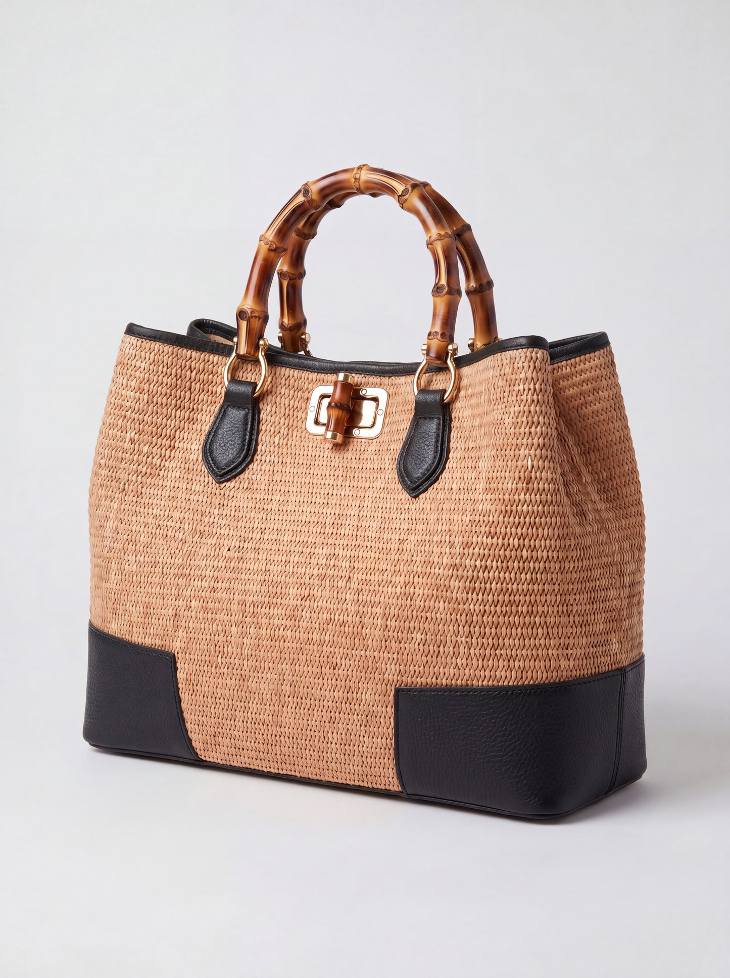 Ginevra Bamboo-Handle Raffia Bag by Clemés in Black, three-quarter studio shot on grey background