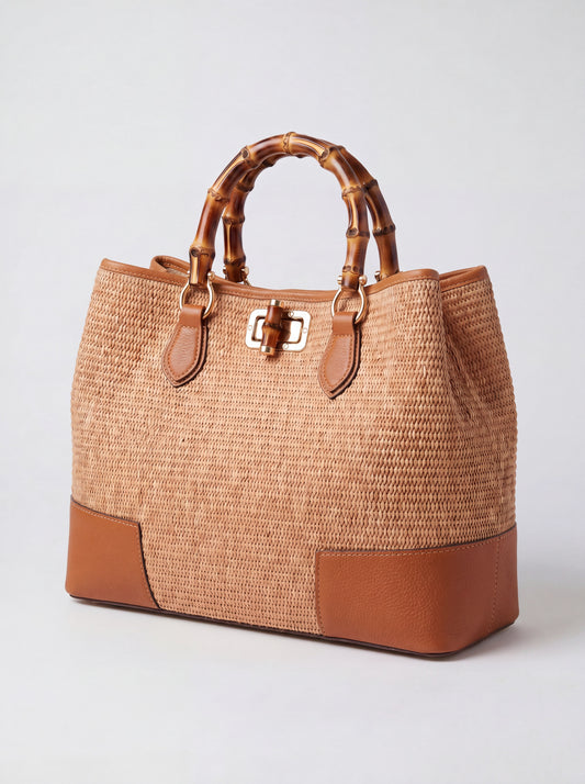Ginevra Bamboo-Handle Raffia Bag by Clemés in Cognac, three-quarter studio shot on grey background