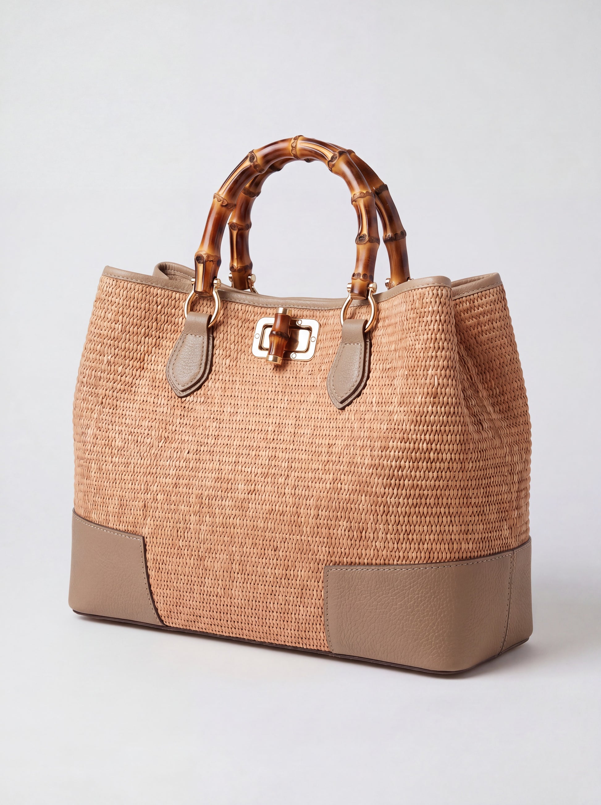 Ginevra Bamboo-Handle Raffia Bag by Clemés in Light Taupe, three-quarter studio shot on grey background