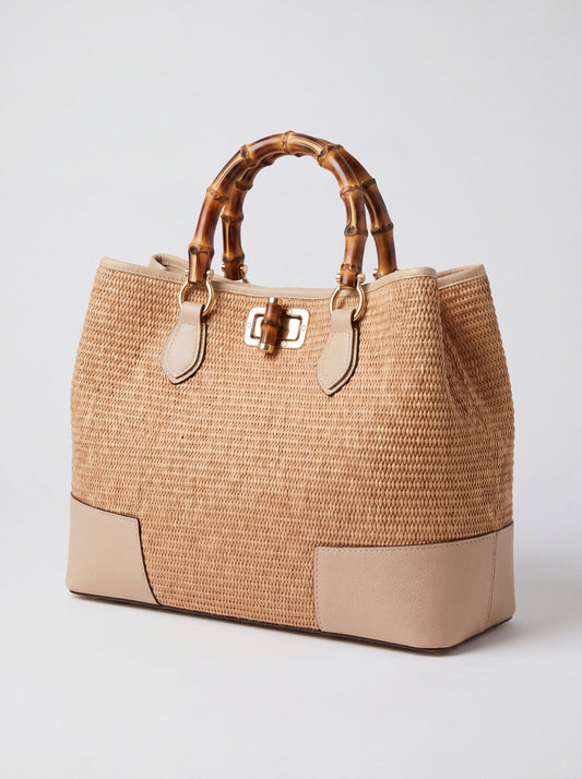 Ginevra Bamboo-Handle Raffia Bag by Clemés in Oyster, three-quarter studio shot on grey background