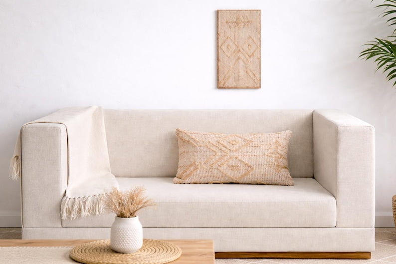 Rust Patchwork Jute Lumbar Cushion on a sofa