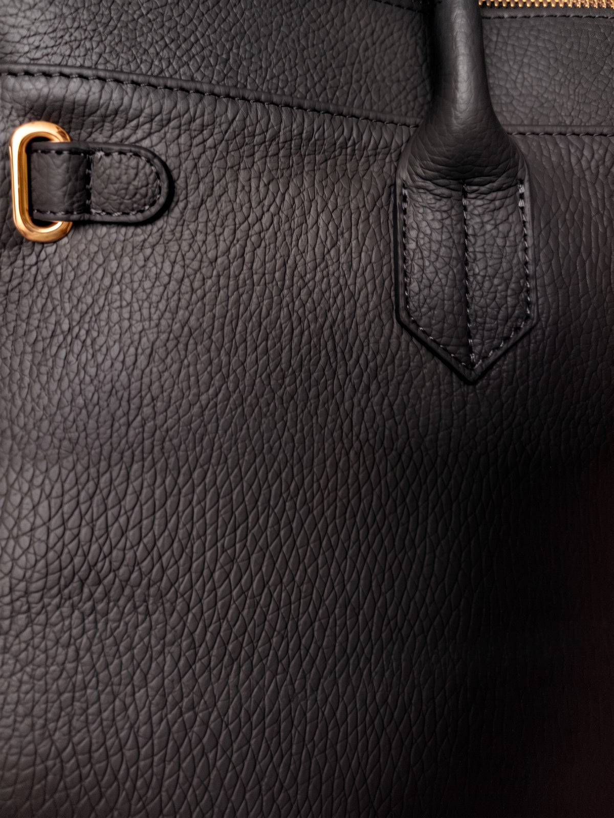 Letizia Black Calfskin Bag by Clemés – leather and handle-tab detail