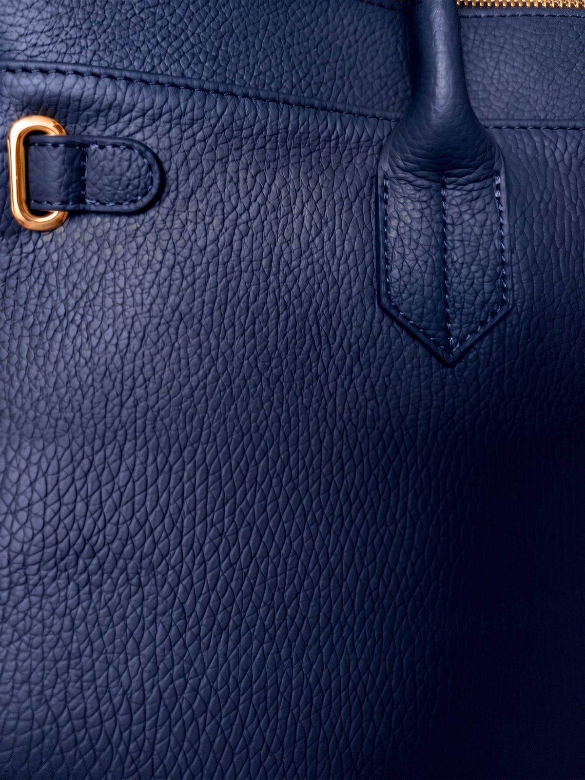 Letizia Navy Calfskin Bag by Clemés – leather and handle-tab detail