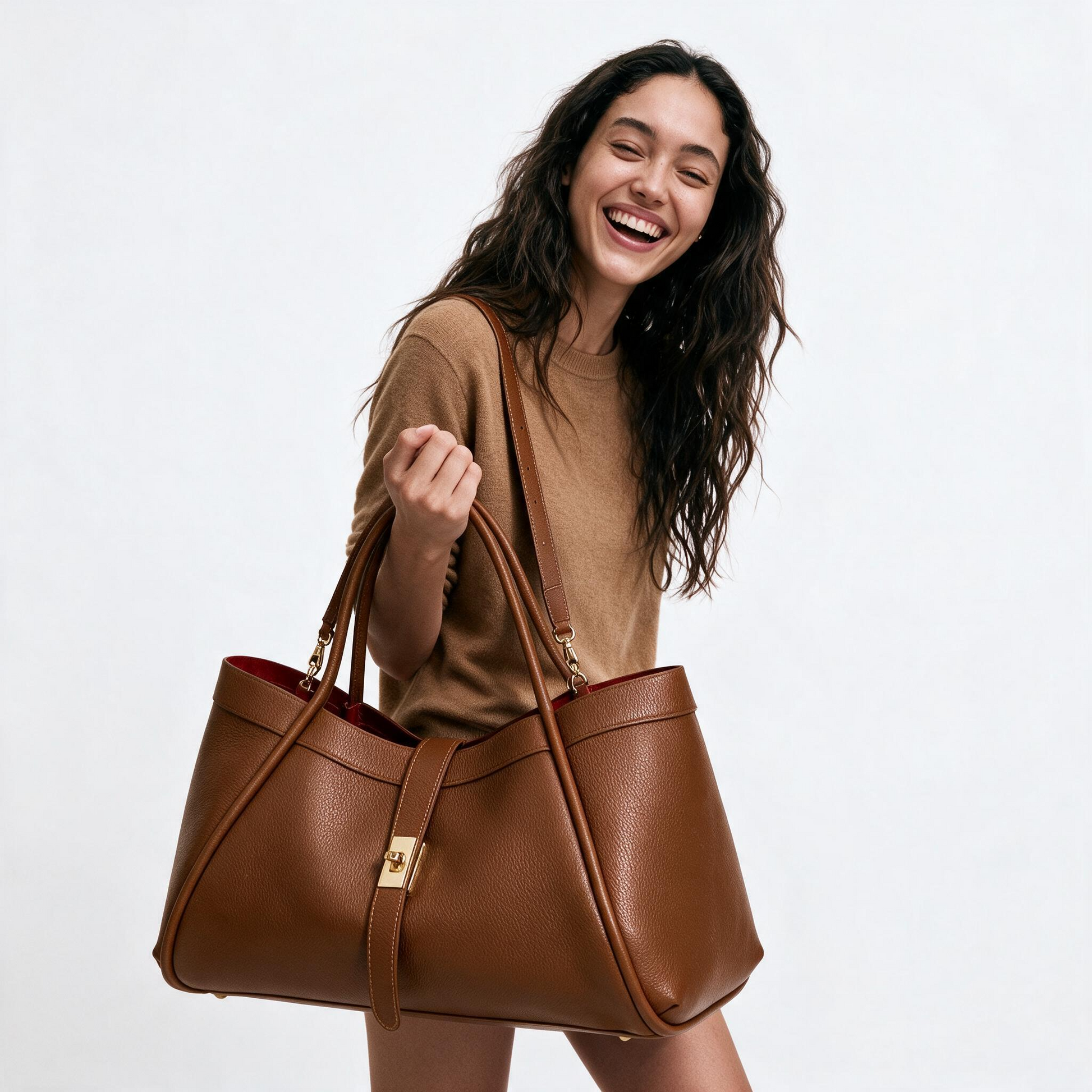 Woman holding the Dark Tan Bianca Large tote, laughing