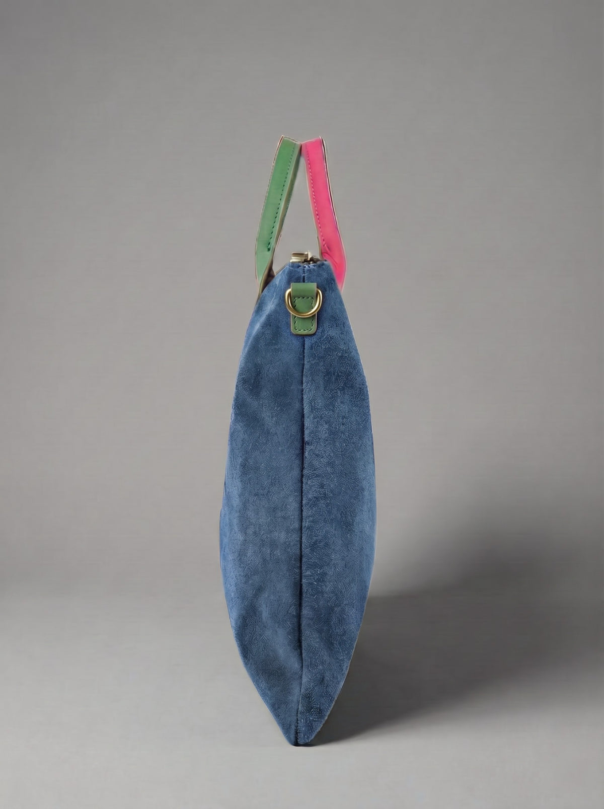 Milano Max Suede Bag in Blue by Clemés, side profile showing the slim gusset and pink and green handles