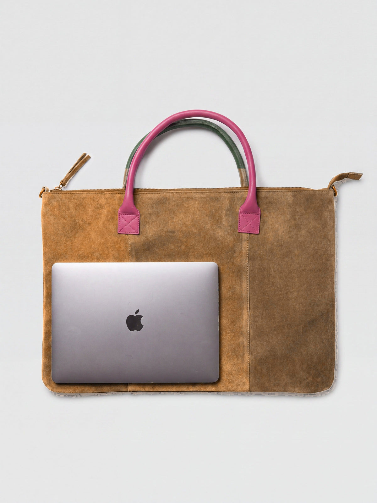Milano Max Suede Bag in Tan by Clemés, flat overhead studio shot with a 13-inch MacBook on the bag showing how much it holds