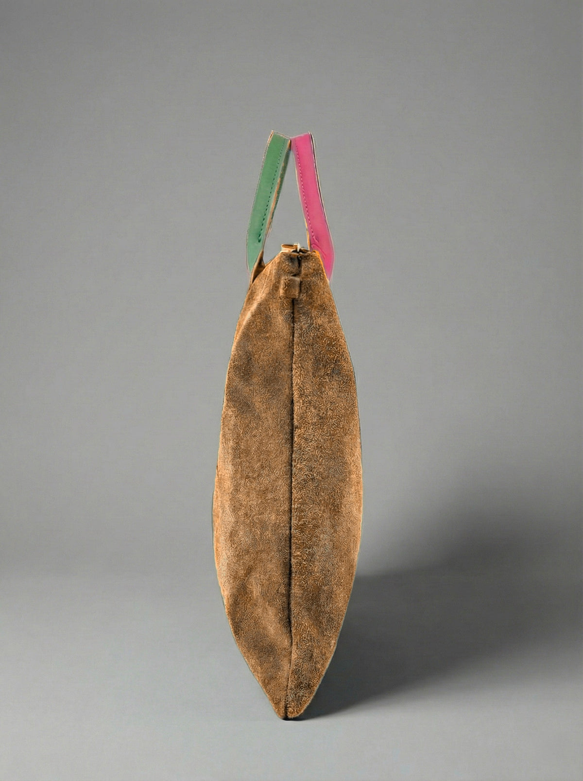 Milano Max Suede Bag in Tan by Clemés, side profile showing the slim gusset and pink and green handles