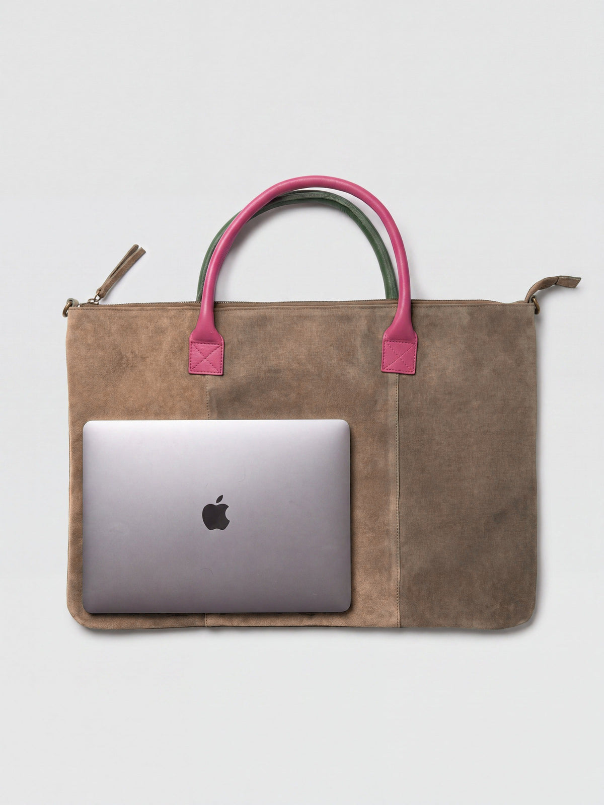 Milano Max Suede Bag in Taupe by Clemés, flat overhead studio shot with a 13-inch MacBook on the bag showing how much it holds