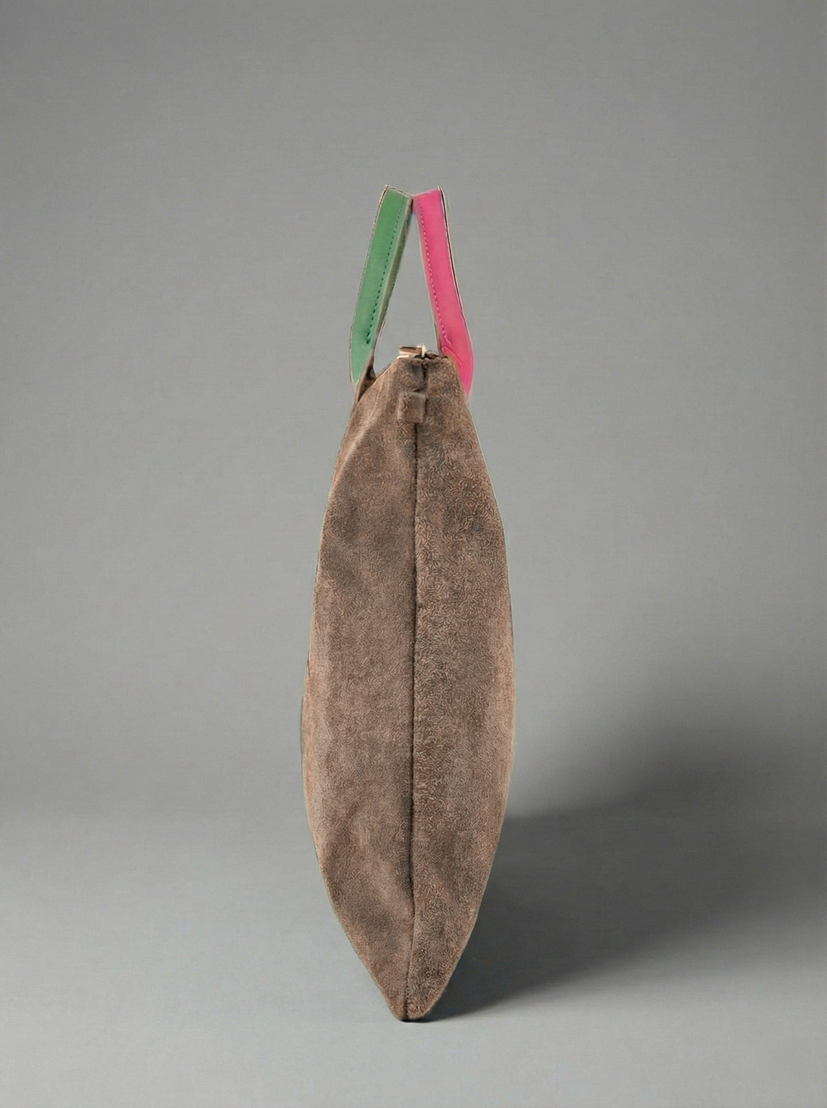 Milano Max Suede Bag in Taupe by Clemés, side profile showing the slim gusset and pink and green handles