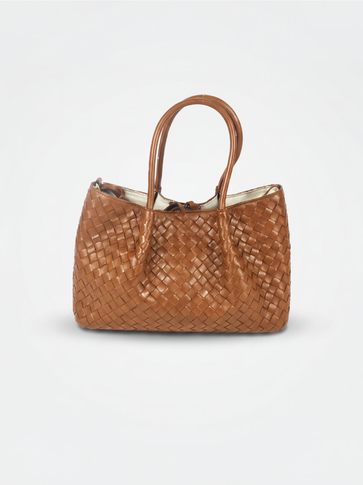 Ornella woven leather bag by Clemés in Cognac, professional studio shot with contact shadow