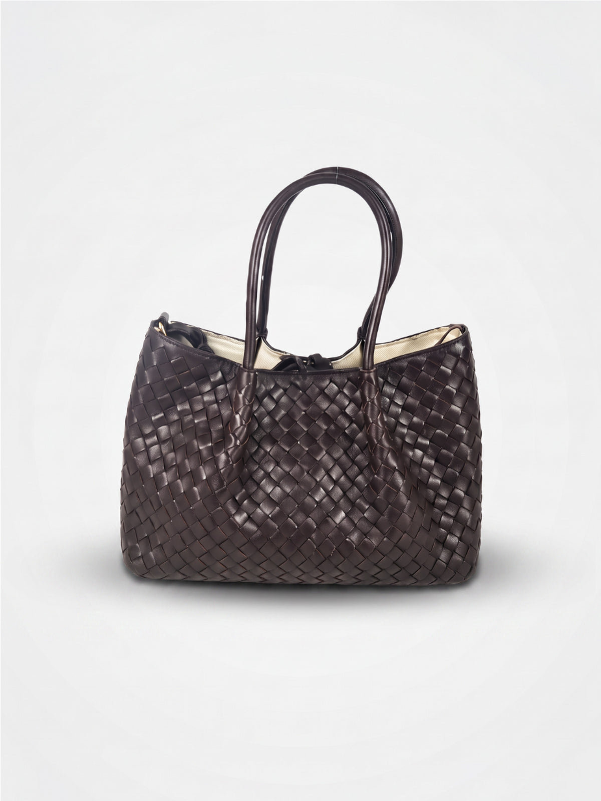 Ornella woven leather bag by Clemés in Dark Brown, professional studio shot with contact shadow