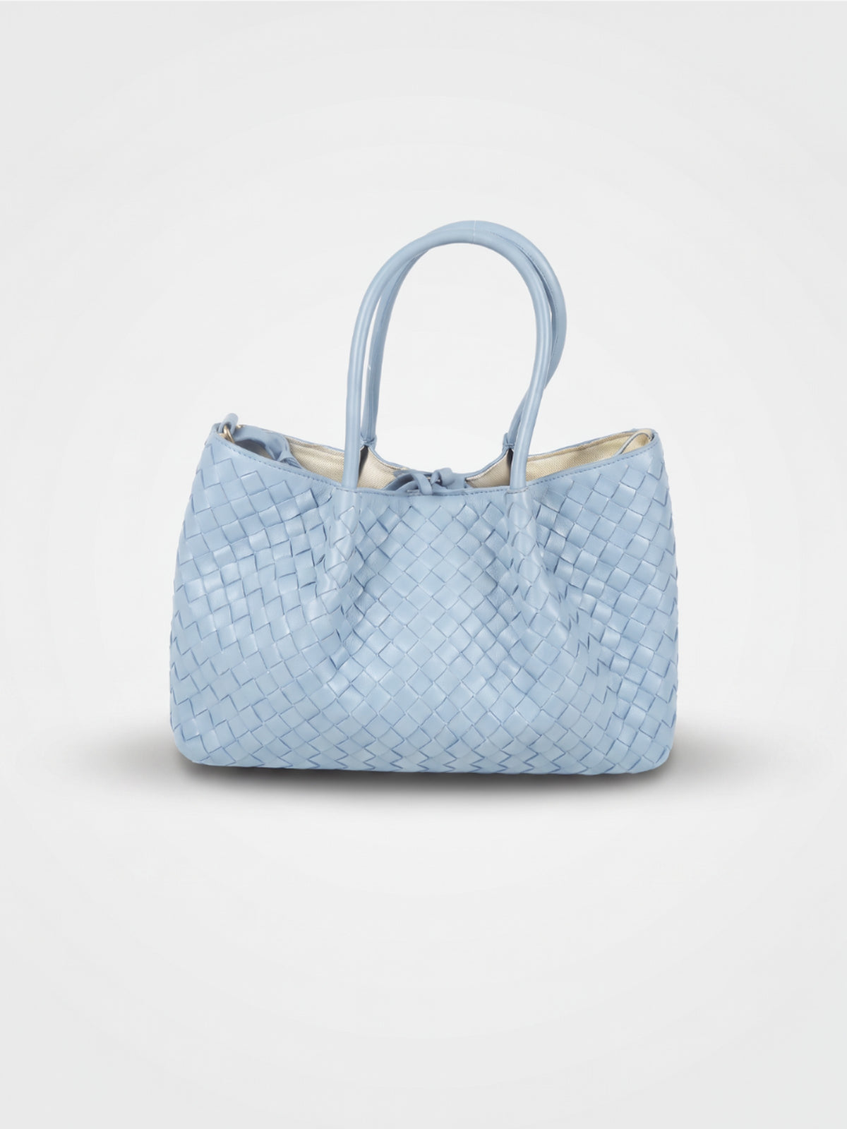 Ornella woven leather bag by Clemés in Sky Blue, professional studio shot with contact shadow