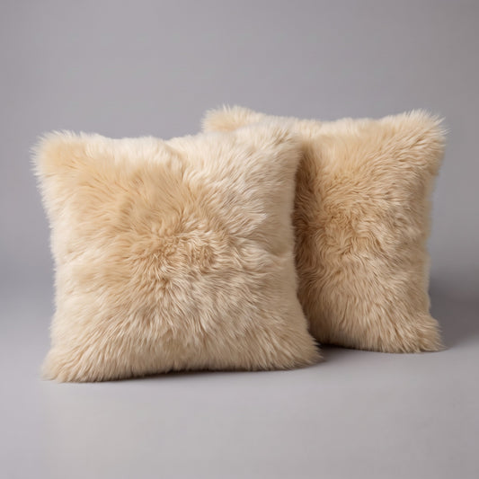 Pair of Champagne double-sided New Zealand sheepskin cushion covers, 35 x 35 cm, side by side