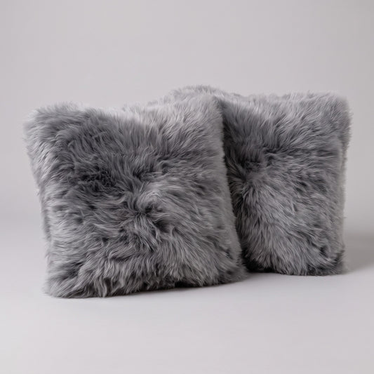 Pair of Grey Mist New Zealand sheepskin cushion covers, 35 x 35 cm, side by side