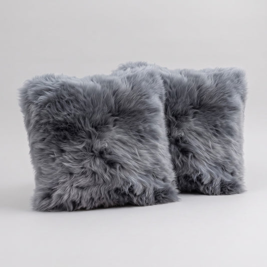 Pair of Steel New Zealand sheepskin cushion covers, 35 x 35 cm, side by side