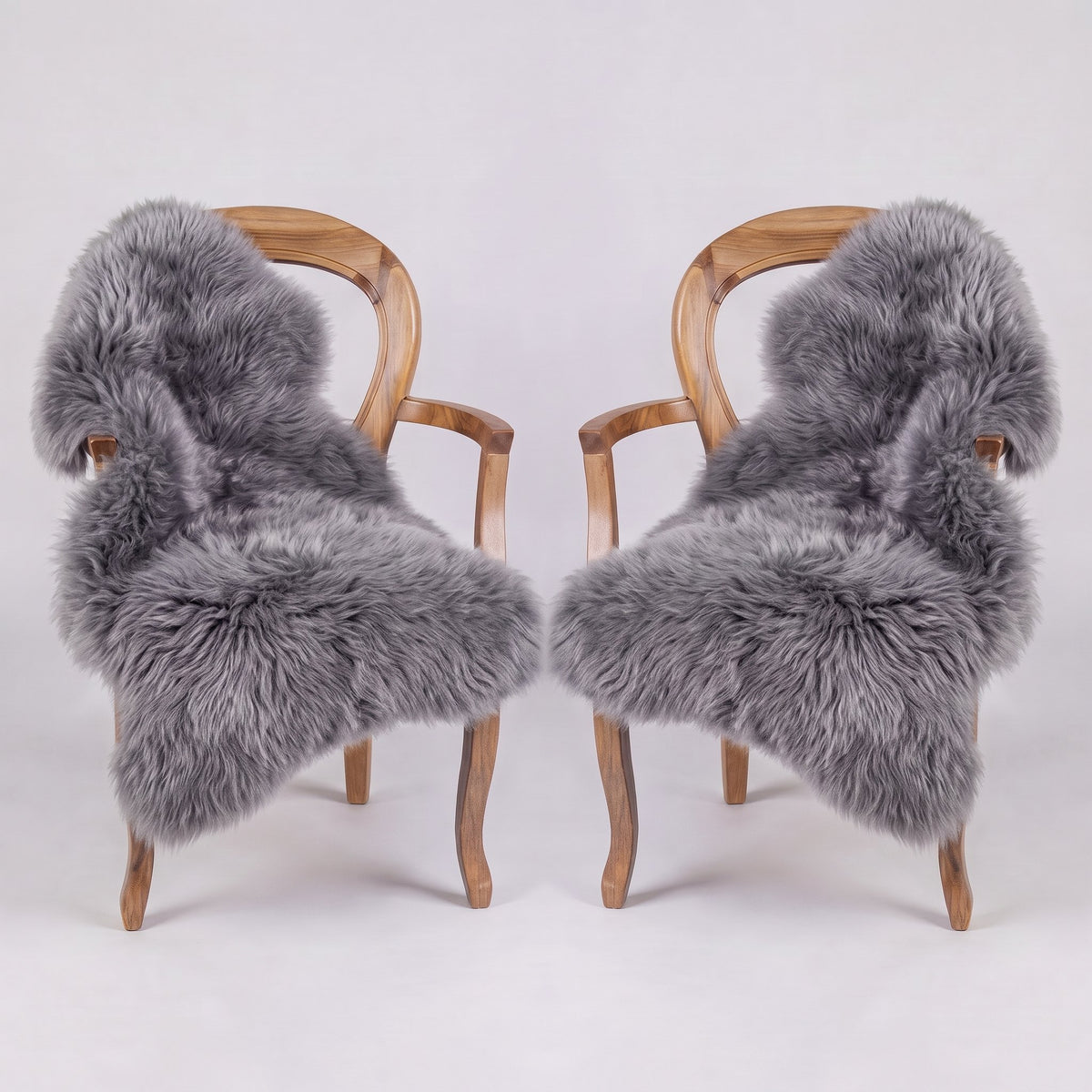 Pair of Grey X-Large single sheepskin rugs draped over two armchairs