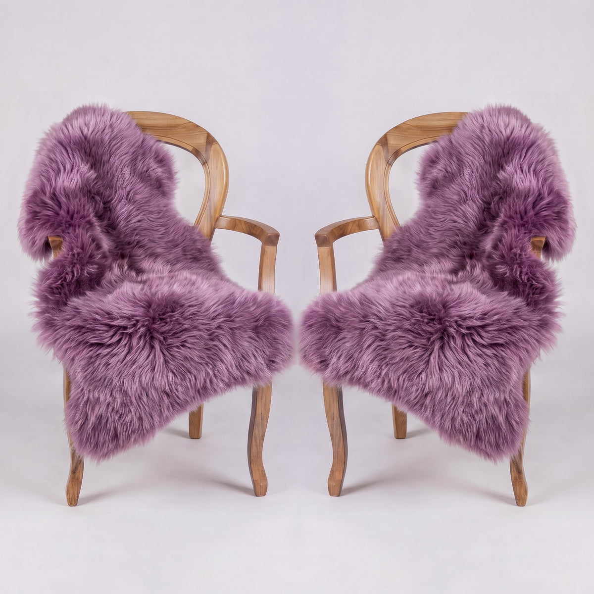 Pair of Medici X-Large single sheepskin rugs draped over two armchairs