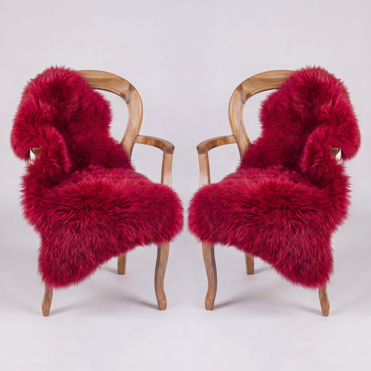 Pair of Wildfire X-Large single sheepskin rugs draped over two armchairs