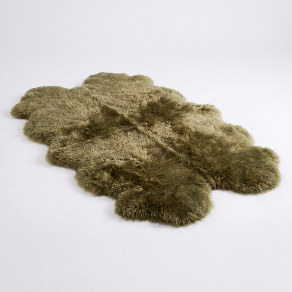 Quad New Zealand Sheepskin Rug & Throw in Apple Green (Meadow), studio shot