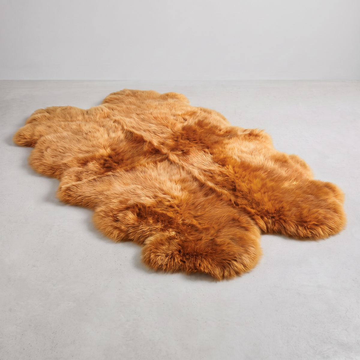 Quad New Zealand Sheepskin Rug & Throw in Honey, studio shot