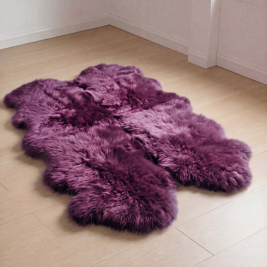 Purple (Hera) New Zealand sheepskin quad rug on wood floor