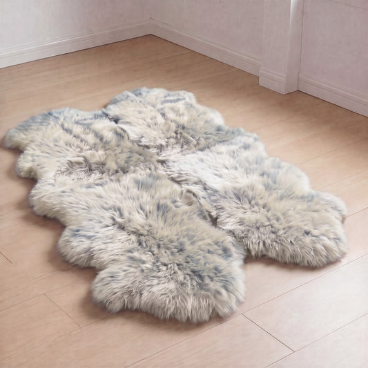 Grey Mist quad New Zealand sheepskin rug, cream wool with blue-grey tipping, L180 x W105 cm, on a wooden floor