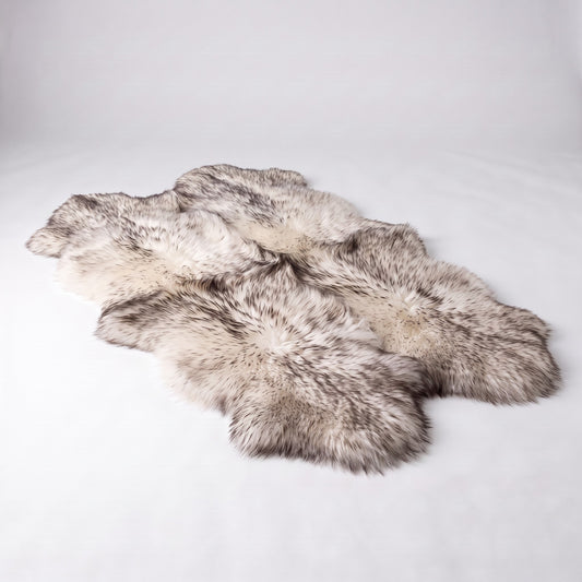 Wolf Tip New Zealand sheepskin rug, Quad size, ivory wool with dark tips, studio shot