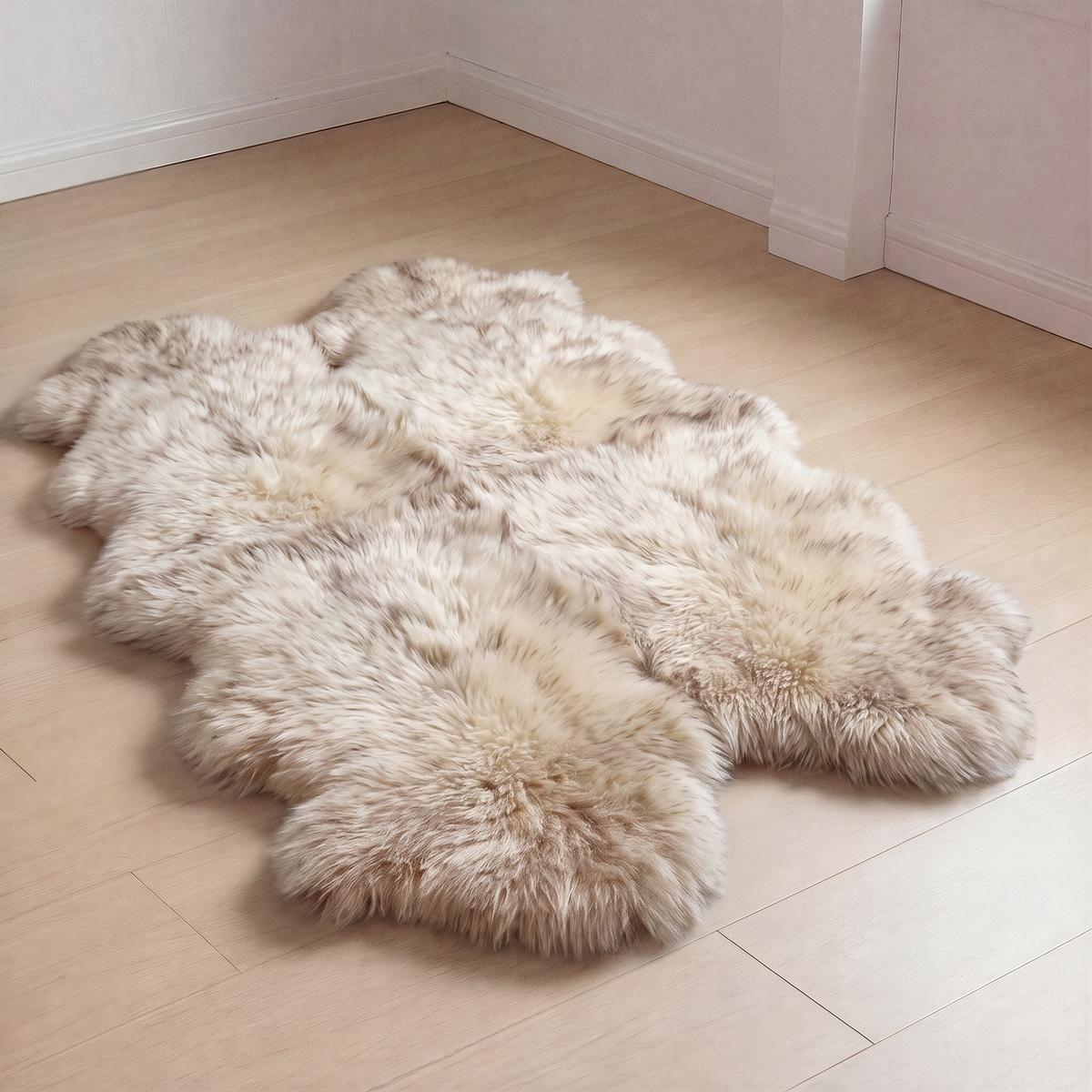 Wolf Tip New Zealand sheepskin rug, Quad size, laid on a wooden floor