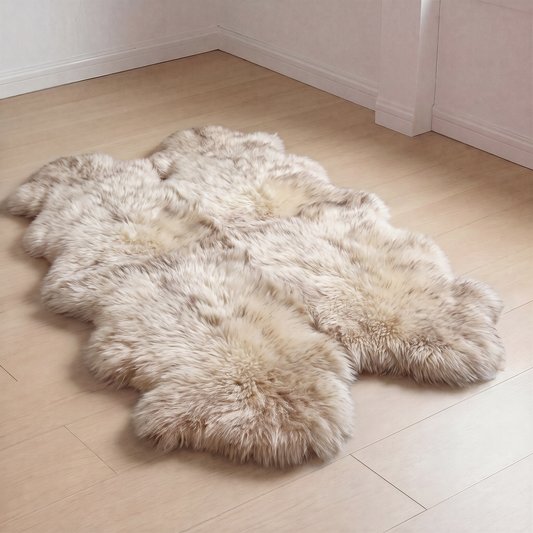 Wolf Tip New Zealand sheepskin rug, Quad size, laid on a wooden floor