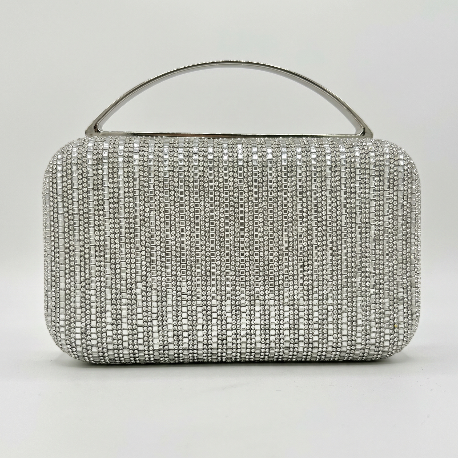 Odette Crystal Minaudière Clutch by Clemés in Silver on light grey studio background