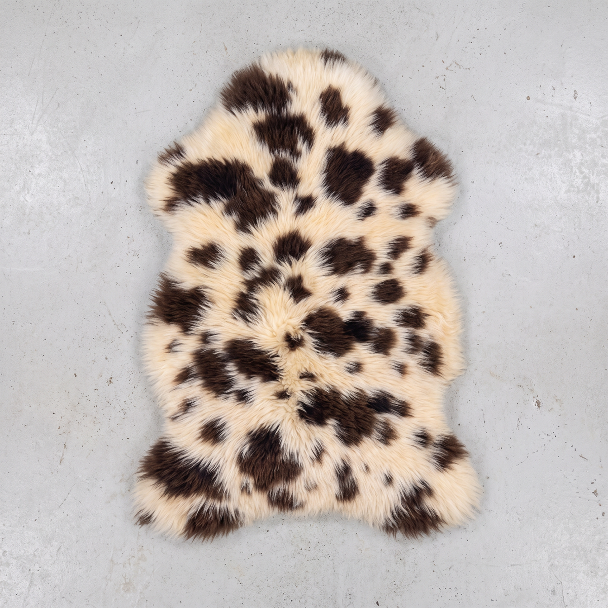 Printed Jacob single sheepskin pelt flat-lay on a pale grey floor