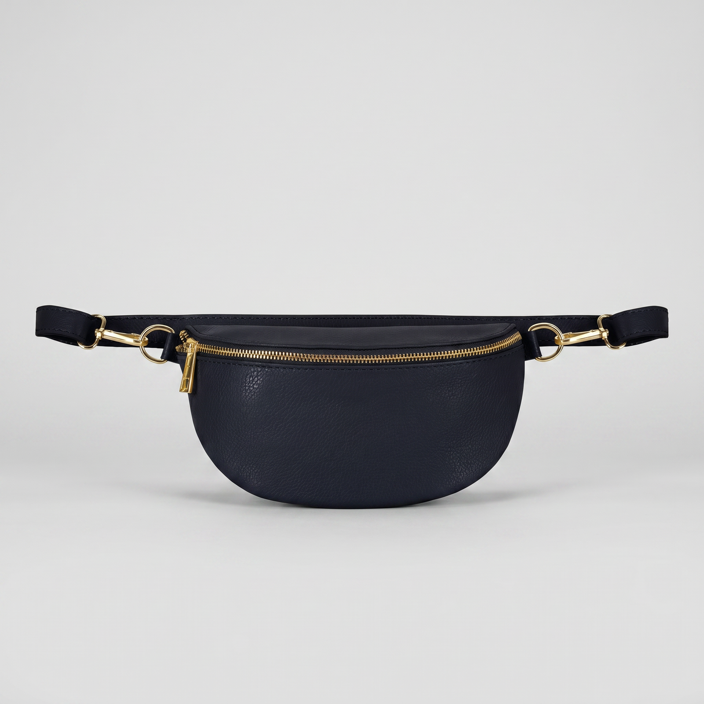 Romy leather crossbody bum bag in Navy on light grey studio background