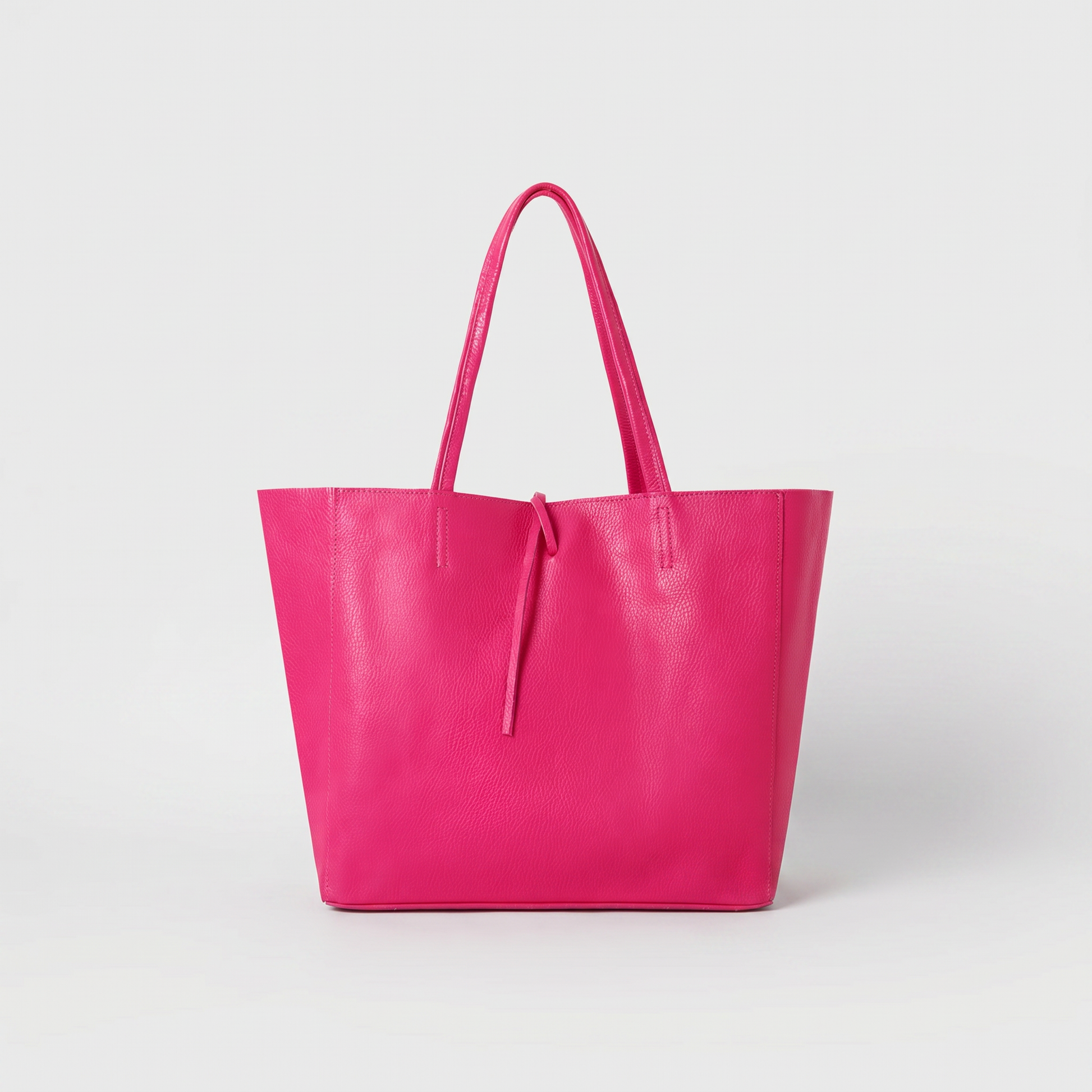 Carlotta Oversized Leather Tote in Fuchsia on light grey studio background