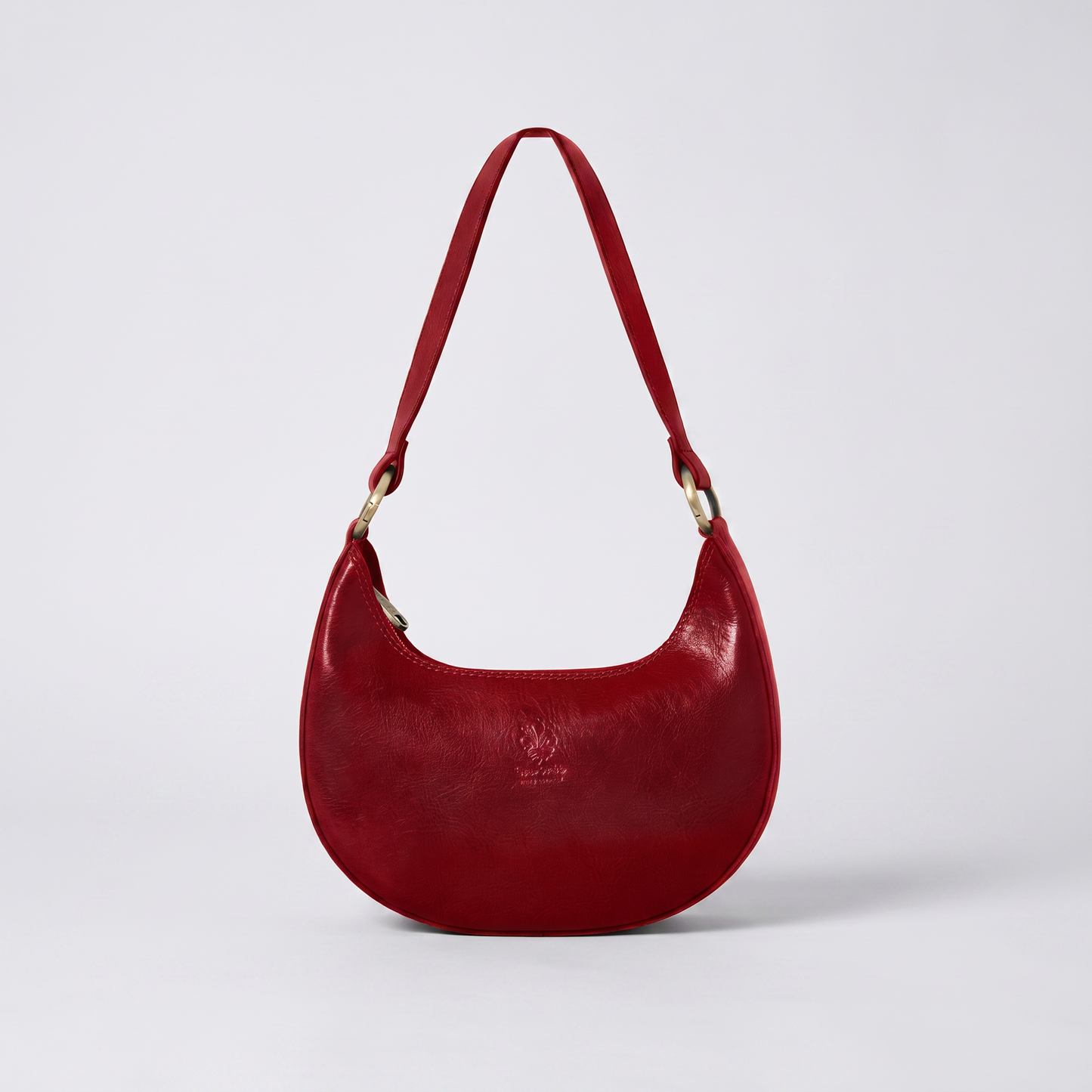 Mezzaluna leather shoulder bag in Dark Red on light grey studio background