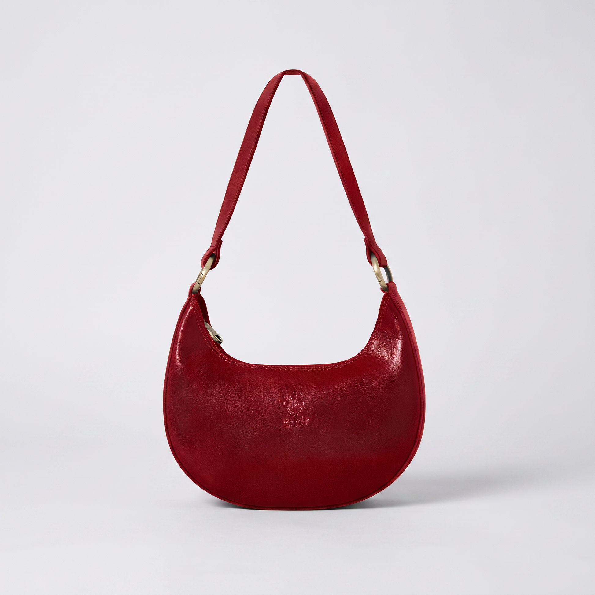 Mezzaluna leather shoulder bag in Dark Red on light grey studio background