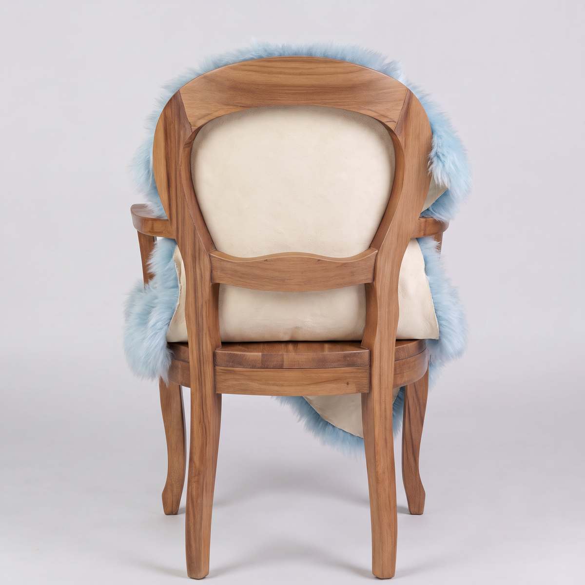 Sea Foam sheepskin over an armchair back, suede leather underside facing the camera
