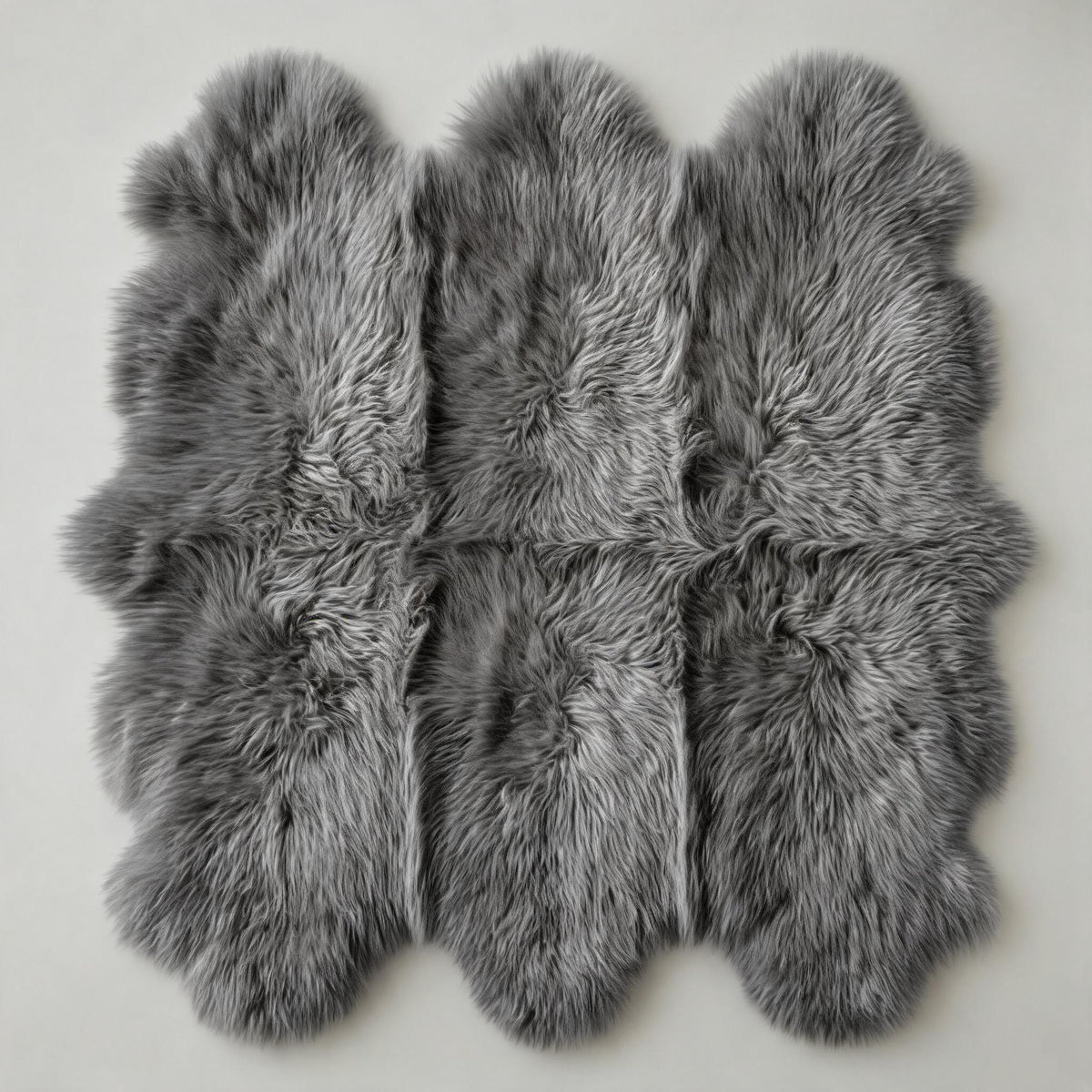 Grey Sexto New Zealand sheepskin rug & throw, 6-pelt, L180 x W150 cm, on a light grey studio backdrop