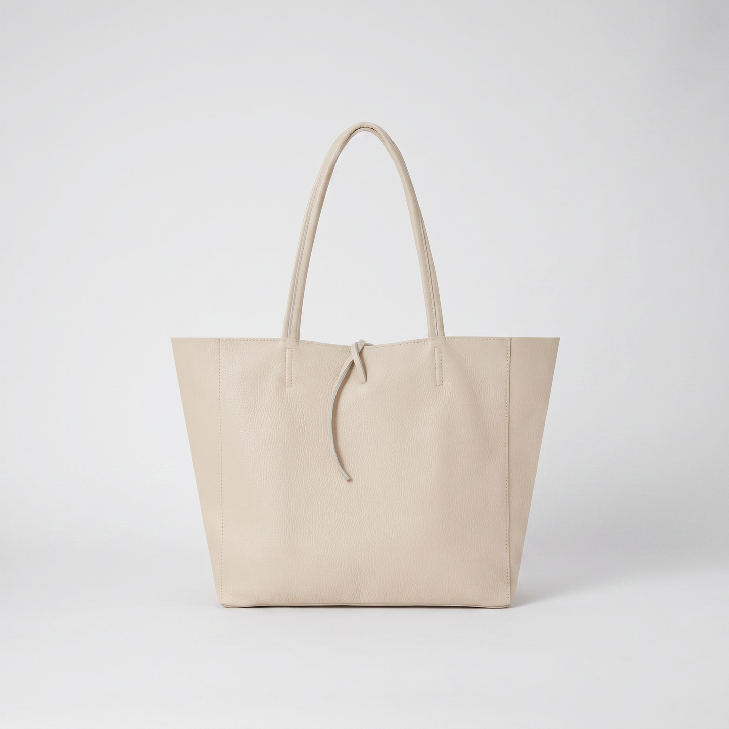 Carlotta Oversized Leather Tote in Cream on light grey studio background
